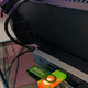 A USB drive is plugged into a dock holding the Steam Dock.